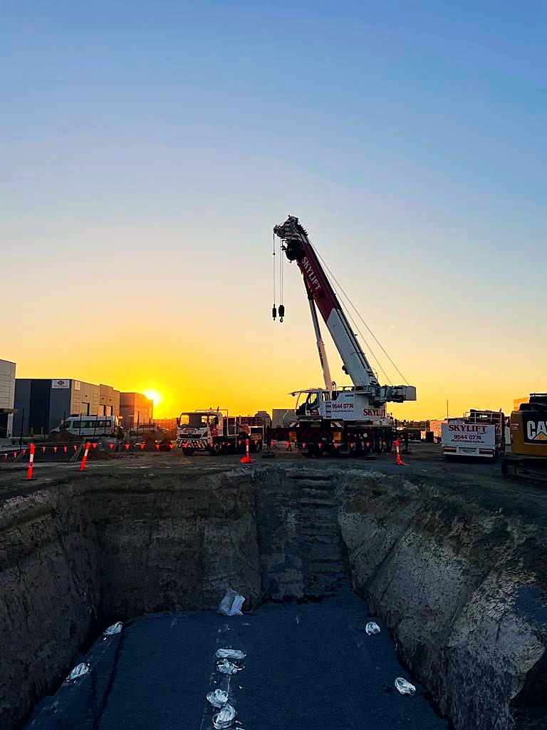 Premium Fuel Installations crew and crane lifting a fuel tank on a fuel site
